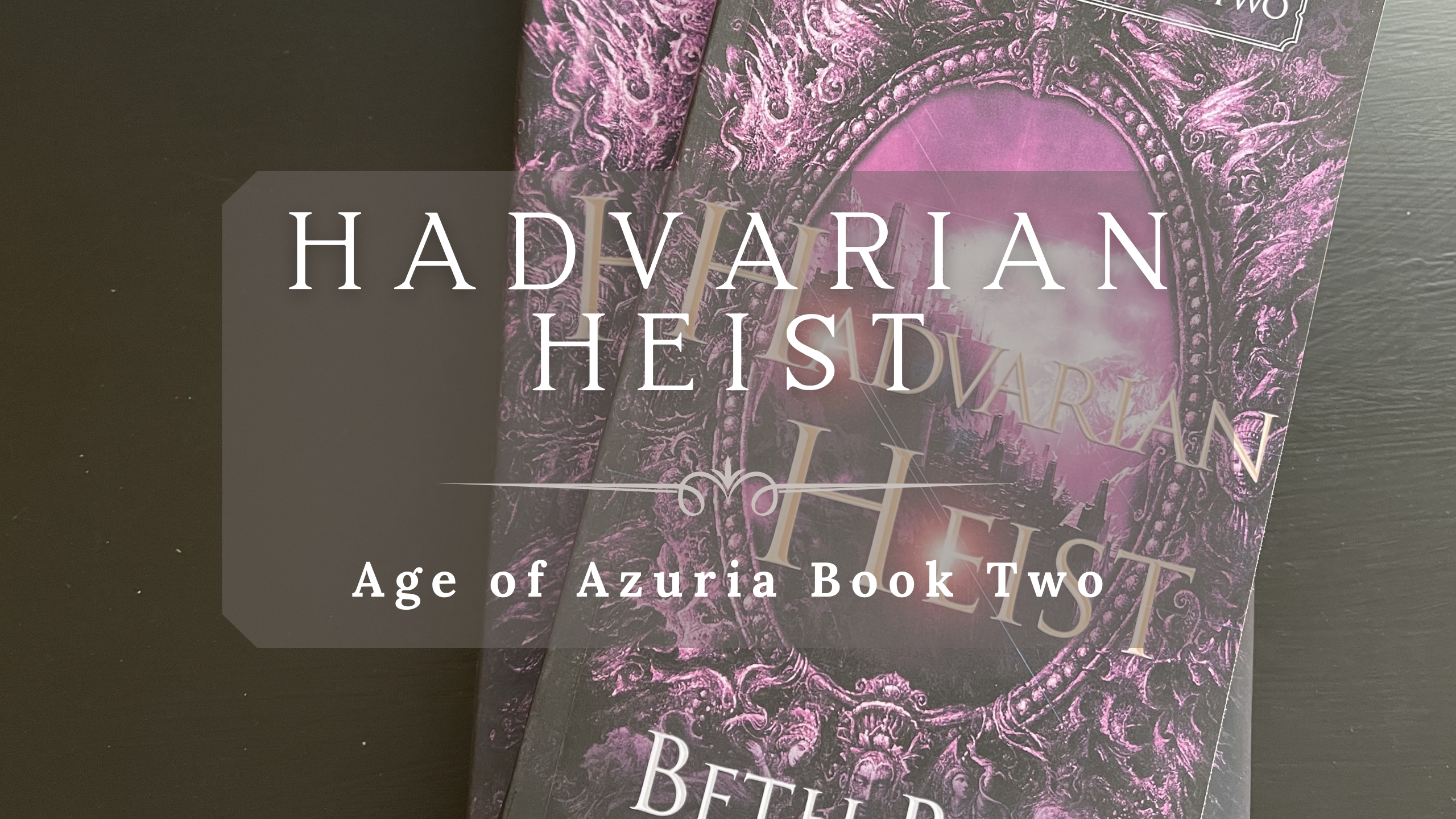 picture of two copies of Hadvarian Heist with text overlay that reads Hadvarian Heist Age of Azuria Book Two